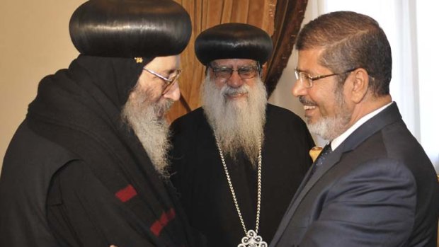 Welcome ... Mohammed Mursi with Coptic bishops.