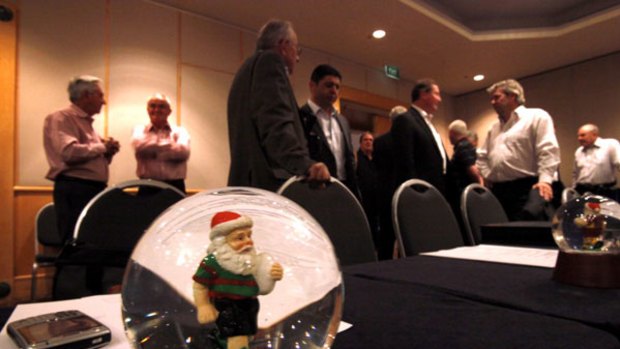 So, Santa's a Souths fan . . . NRL chief executives take a break at their conference held in Coogee.
