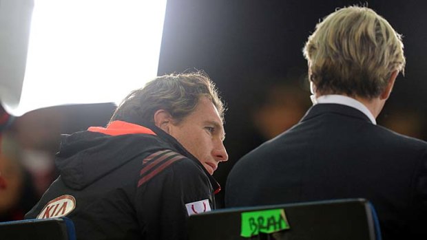 Under the spotlight: Essendon coach James Hird talks with Fox Footy before his team's 79-point loss to Collingwood.