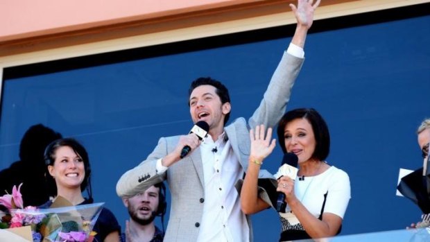James Mathison and Natarsha Belling farewell <i>Wake Up</i> fans at Manly Beach.