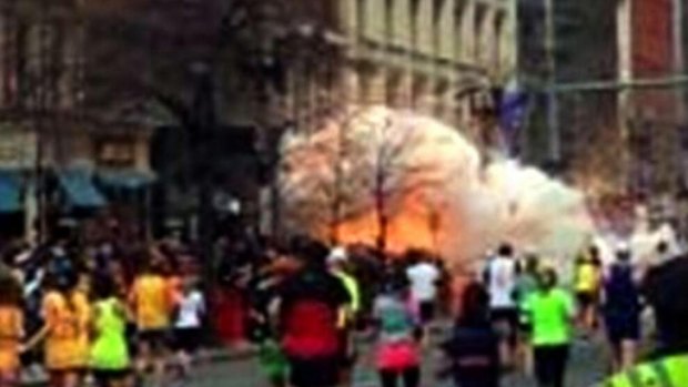 One of the explosions near the marathon finish line was captured on camera as runners headed straight for it.