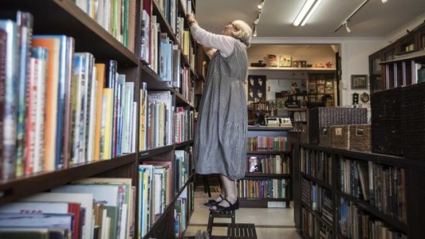 Book heaven: Margaret Dunstan, owner of Love Vintage Books  checks the shelves.