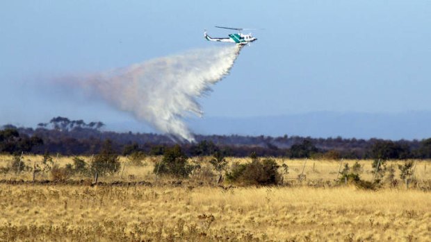 Firefighters douse grassfire near Little River.