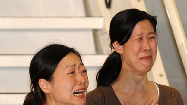 This file photo taken on August 5, 2009 shows freed US journalists Euna Lee (left) and Laura Ling (right) arriving after being released from North Korea, at the airport in Burbank, California.