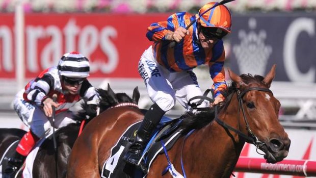 Two years running: Fontelina, ridden by Peter Robi, wins race eight on Derby Day at Flemington.