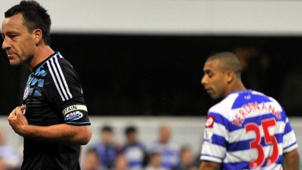 Racial abuse claim ... QPR's Anton Ferdinand looks on as John Terry speaks with the referee (not pictured).