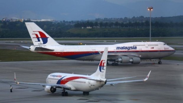 Malaysia Airlines aircrafts taxi on the runway at Kuala Lumpur International Airport. The search continues for Flight MH370, which went missing on March 8 with 239 crew and passengers on board.