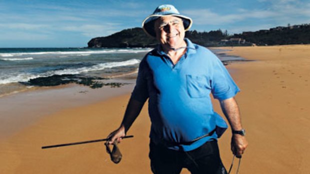 Hooked ... Col Buckley has been plucking beach worms from the sand for decades.