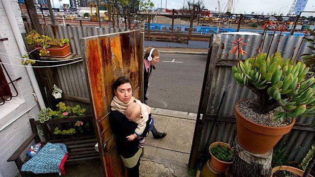 Shunting all hours: Victoria Huf with son Reuben at her home, which is straight across from the rail line.