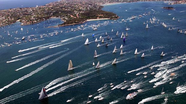 Out in front: Wild Oats XI leads the start of the Sydney to Hobart race as the yachts sail out of Sydney Harbour.