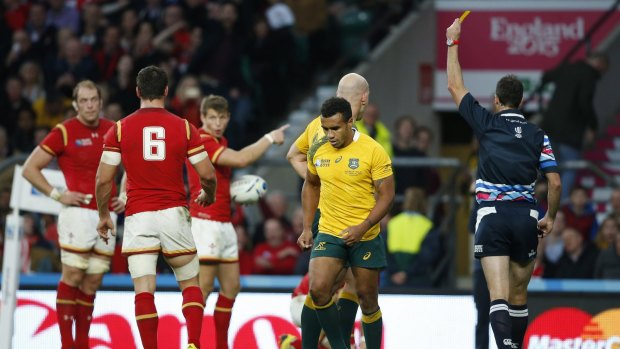 Ten in the bin: Australia's Will Genia walks from the field after getting a yellow card from referee Craig Joubert during the Rugby World Cup Pool A match between Australia and Wales at Twickenham.
