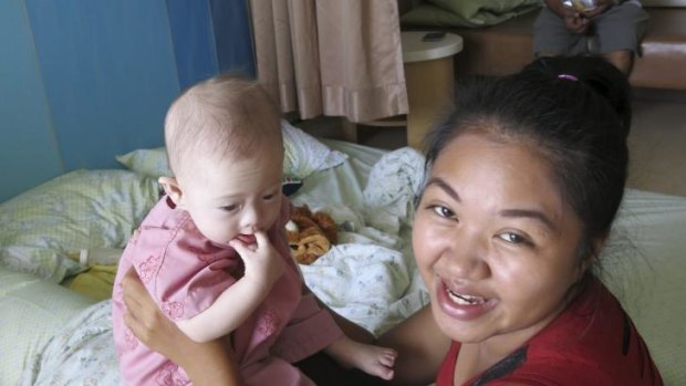 Pattharamon Janbua holds Gammy in a Thailand hospital on Sunday.