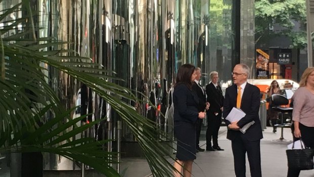 Queensland Premier Annastacia Palaszczuk and Prime Minister Malcolm Turnbull talk outside Waterfront Place, in Brisbane.?