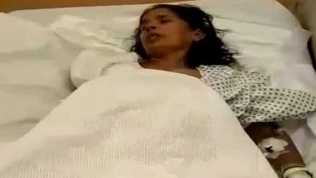Kasturi Munirathinam in hospital after her right hand was allegedly chopped off by her employer.