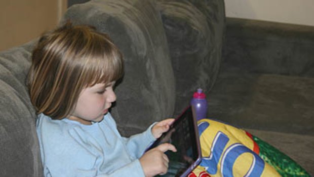 Little Sienna using her iPad.