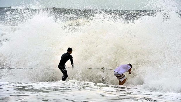 Teenagers brave the heavy surf at Collaroy Beach in Sydney's northern beaches.