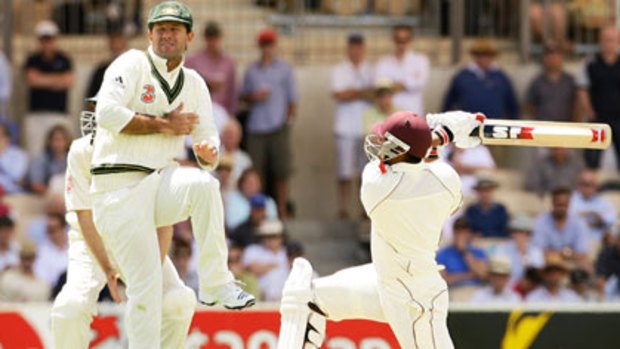 Big hitter ... Australian captain Ricky Ponting takes evasive action as West Indies batsman Ravi Rampaul lashes out at Adelaide Oval yesterday. Rampaul hit an unbeaten 40 in his side’s total of 451.