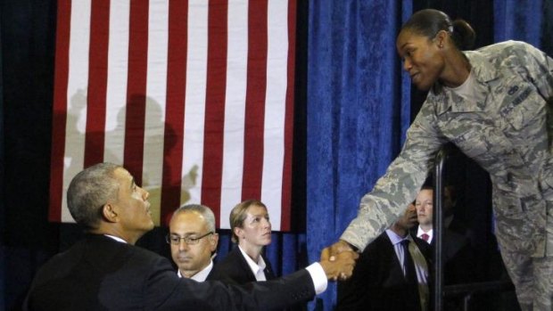 President Barack Obama thanks a military member after his speech.