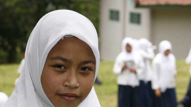 Parhin, a 14-year-old student who hopes to become a doctor, is studying at a Lombok high school build with Australian aid money.