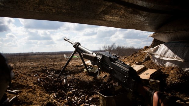 A machine gun rests inside a pro-Russian rebel trench at the weekend.
