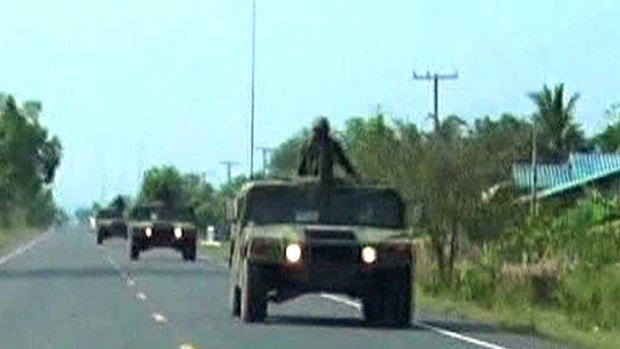 Thai military trucks with soldiers are driven to the Thai-Cambodia border for reinforcement.