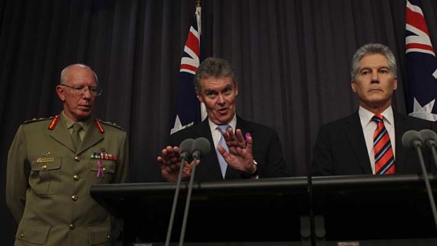 Duncan Lewis (centre), secretary of the Defence department, will leave the role after only a year.