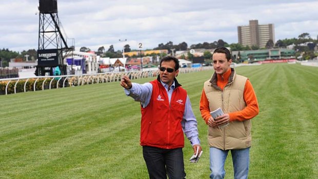 French jockey Christophe Lemaire (right)  is shown around Flemington race course yesterday by Melbourne Cup winning jockey John Marshall.