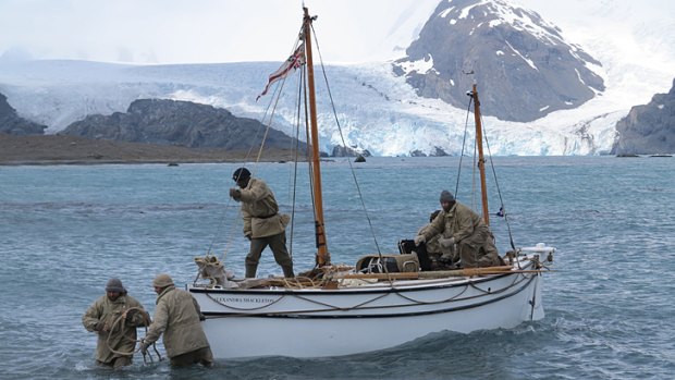 Crew members bringing the vessel Alexandra Shackleton to shore at South Georgia to successfully complete leg one of their historic re-enactment.