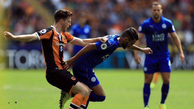 Hull City's Andrew Robertson, left, and Leicester City's Riyad Mahrez in action.