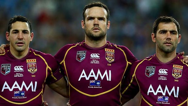 Public enemy number one: Nate Myles, centre, flanked by Billy Slater, left, and Maroons skipper Cameron Smith.