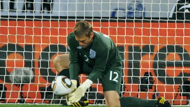 Mistake ... England goalkeeper Robert Green misjudges the ball.