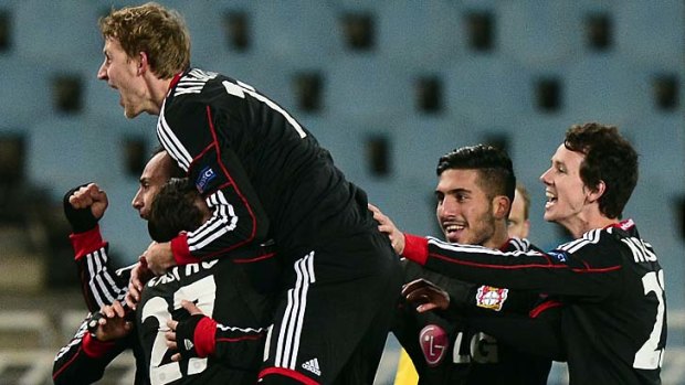 Bayer Leverkusen players, including Australia's Robbie Kruse, far right, celebrate a goal against Real Sociedad.