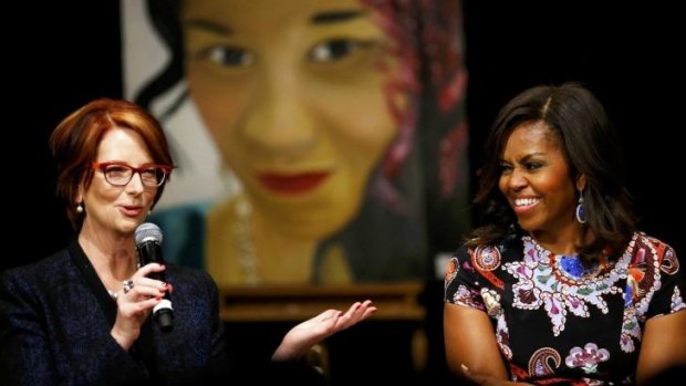 Seize your dreams ... Julia Gilllard (left) joins US First Lady Michelle Obama to speak to pupils during a visit to Mulberry School for Girls in London, Britain.