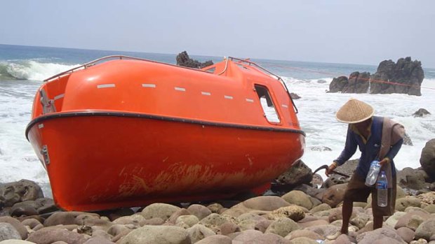 Orange beacon: An Australian-supplied lifeboat onshore at Kebumen in Java.