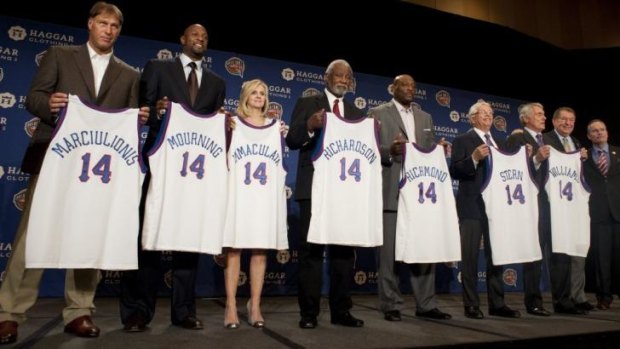 The Naismith Memorial Basketball Hall of Fame 2014 Class (L-R) Sarunas Marciulionis, Alonzo Mourning, Judy Martelli (representing Immaculata University), Nolan Richardson, Mich Richmond, David Stern, and Gary Williams pose with John L. Doleva at the Omni Hotel in Dallas.