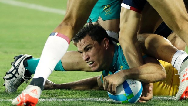 Caught in the ticketgate: Ed Jenkins scoring a try in the men's rugby sevens match against France in Rio.