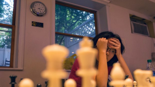 Maggie Feng, 15, at the Marshall Chess Club in New York on Wednesday. She was one of four female masters to participate in an elite clinic at the club.