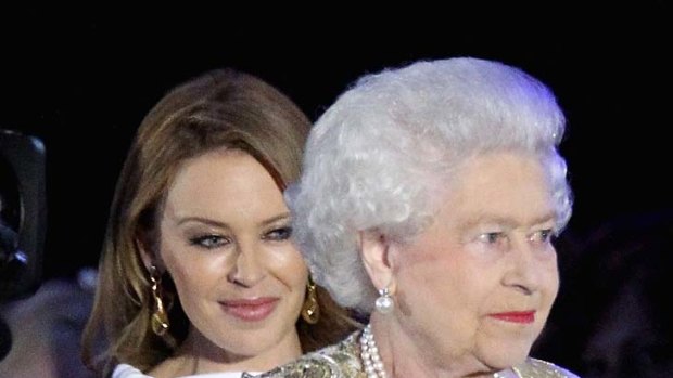 The Queen   and singer Kylie Minogue  on stage during the Diamond Jubilee concert at Buckingham Palace.