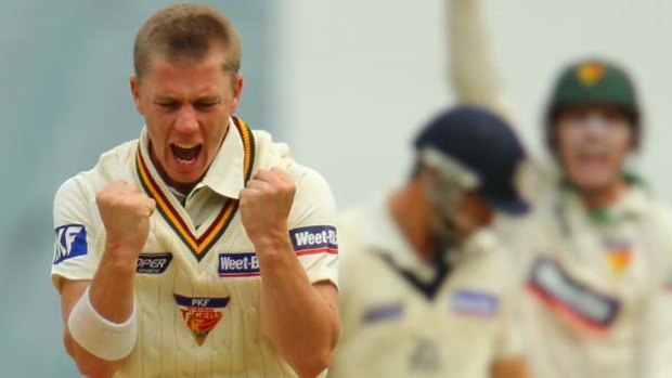 Tasmania's Xavier Doherty grabs the wicket of Victorian Matthew Wade at the MCG.