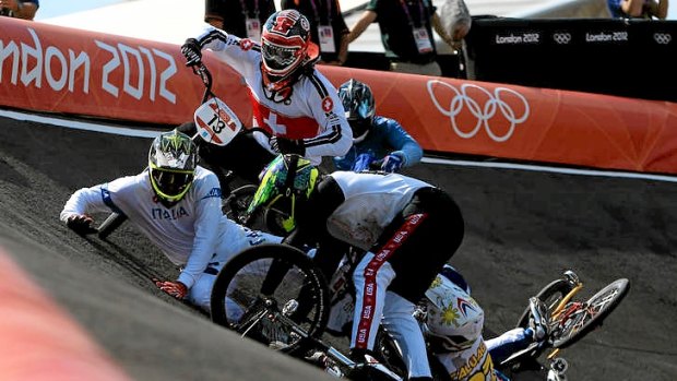 Manuel de Vecchi (left) of Italy goes to ground as the pack crashes during the men's BMX quarter-finals.