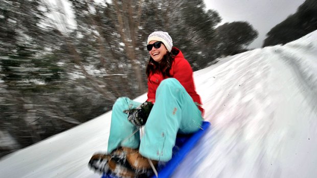 Keira McDonagh gets in some early toboggan practice at Mount Buller.