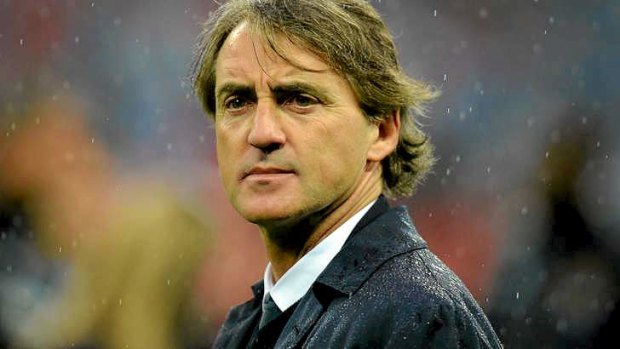 Under pressure: Manchester City's manager Roberto Mancini.