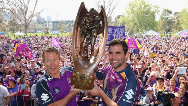 Craig Bellamy and Cameron Smith with the premiership trophy. The club hopes Bellamy will sign a new deal.