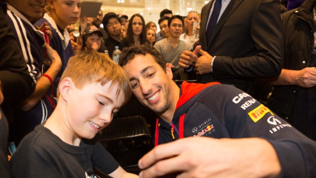Crowd favourite: Daniel Ricciardo meets fans in Melbourne on Wednesday.