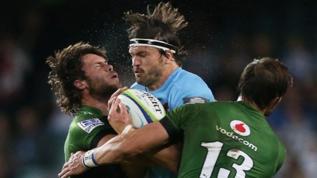 Adam Ashley-Cooper is crunched by the Bulls' defence.