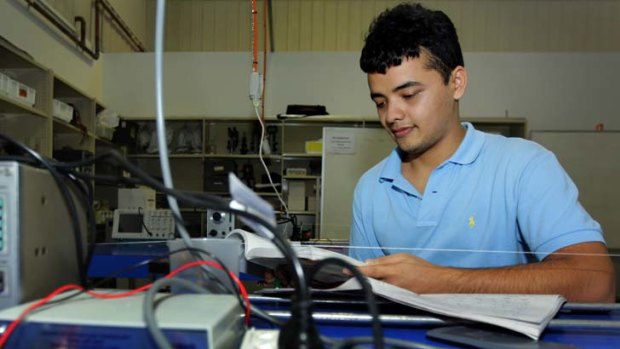 Hard at work &#8230; Al Sina Hassan, who is studying mechanical engineering, in a lab at University of Western Sydney.