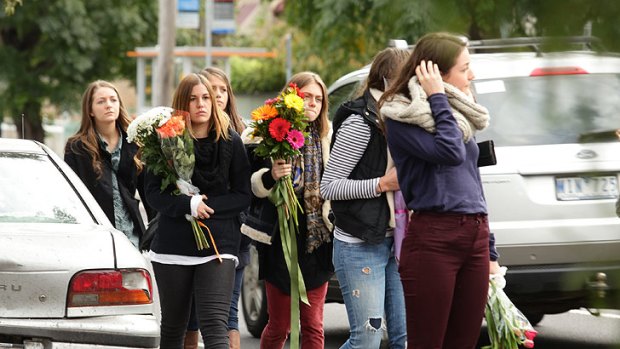 Friends and mourners gather at the scene of the crash in Westgarth Street to lay flowers.