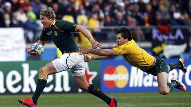 'Passion and guts' ... Wallaby Adam Ashley-Cooper attempts to bring down Jean de Villiers.
