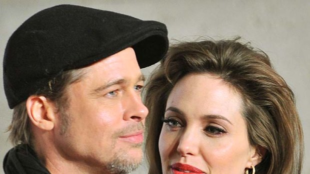 Six children ... Brad Pitt and Angelina Jolie, pictured in December 2010.