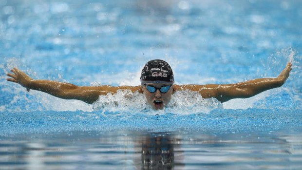 Olympic champion Libby Trickett swam under 60 seconds in heats of the 100 metres butterfly.